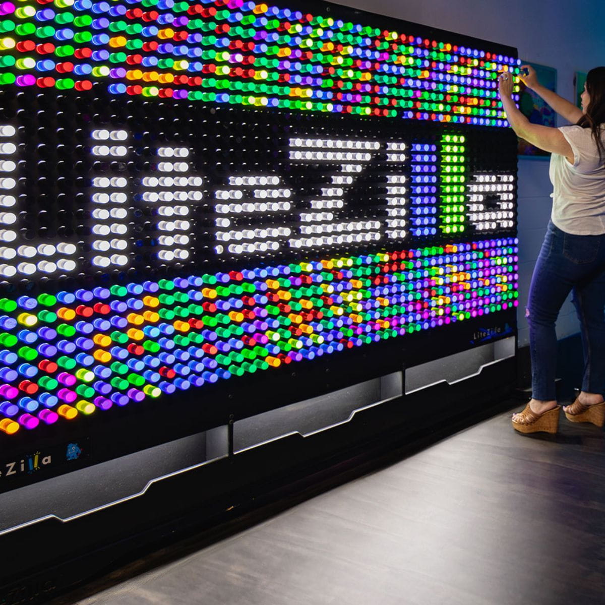 8x5 LiteZilla Giant Lite Brite Wall with lady making a design