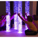 Calming Sensory Room Package with Kid sitting on platform playing with purple bubble tube