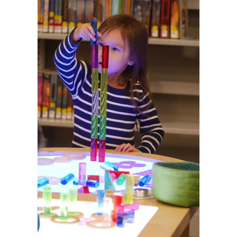 Child stacking colored blocks on the Spectrum Light Lab