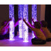 Child with hands around the lit up Calming Bubble Tube