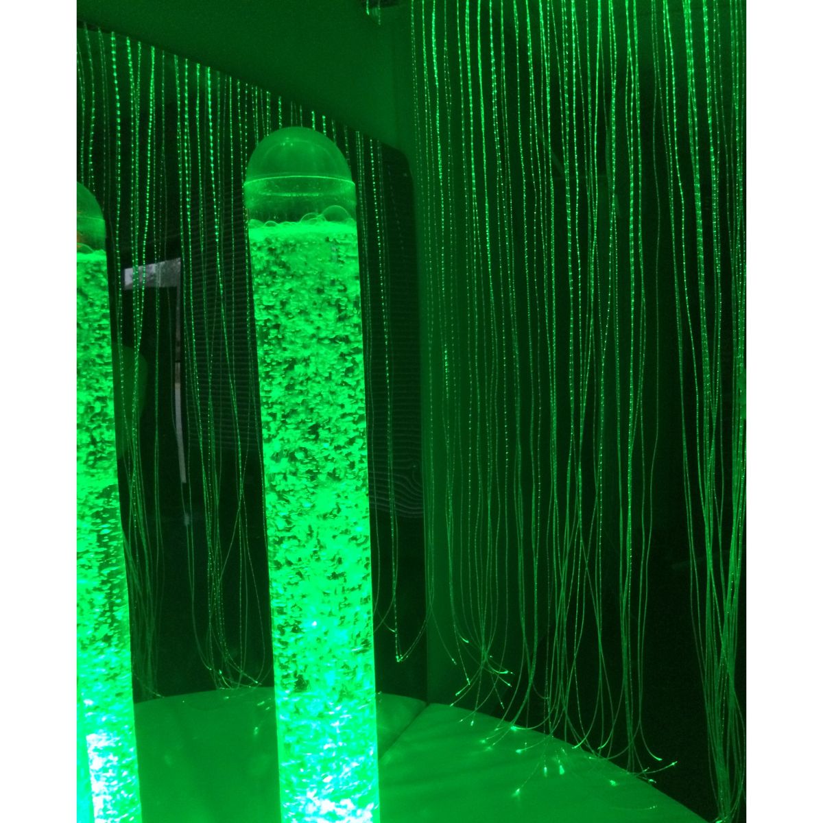 Closeup of green bubble tube inside the Sensory Cocoon 