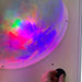 Closeup of hand adjusting the wall mounted Sound Light Dome