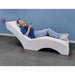 Experia USA Vibro Acoustic Lounger person with headphones laying on it