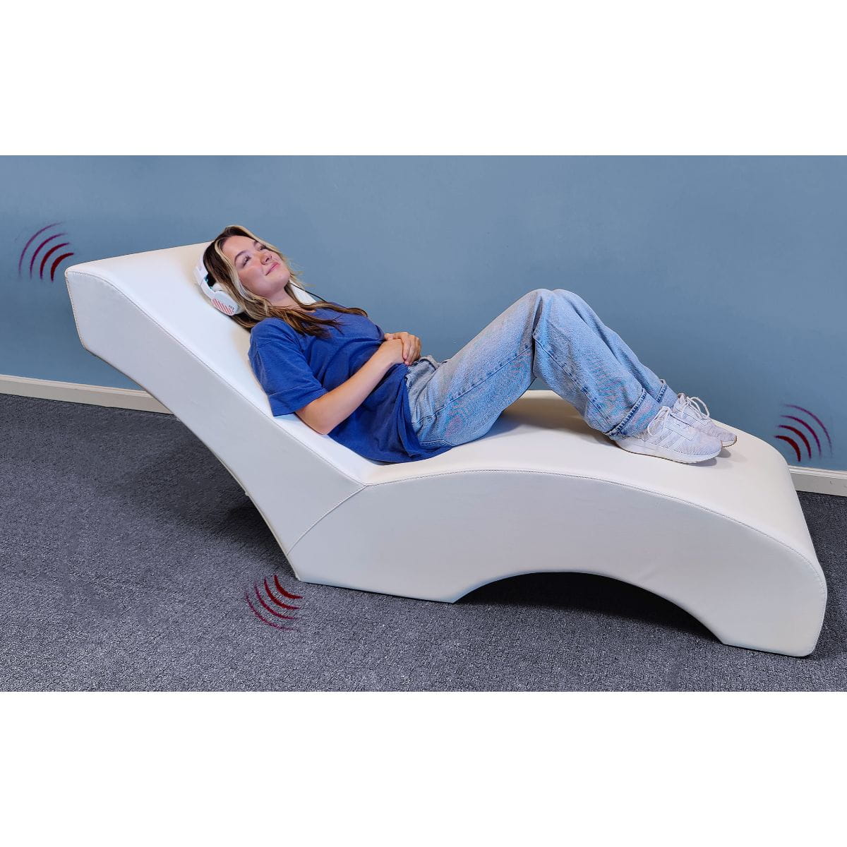 Experia VibroAcoustic Lounge Chair with person on it listening to headphones