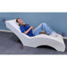Experia VibroAcoustic Lounge Chair with person on it listening to headphones