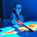 Girl painting an image from Budii Interactive Projector