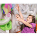 Girl reaching for scarf to put in the LiteZilla Ultimate Scarf Launcher