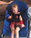 Girl smiling in the Sensory Bouncy Chair