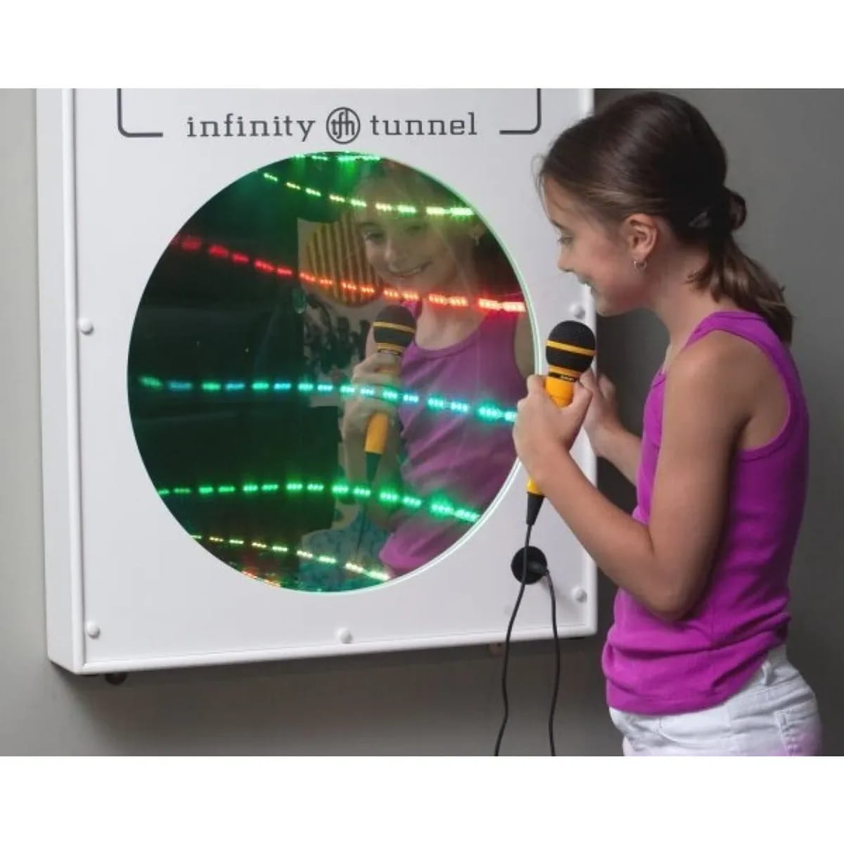 Girl with microphone singing into the Infinity Tunnel Mirror