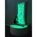 Green color on the Sensory Calming LED Bubble Wall and kid smiling next to it
