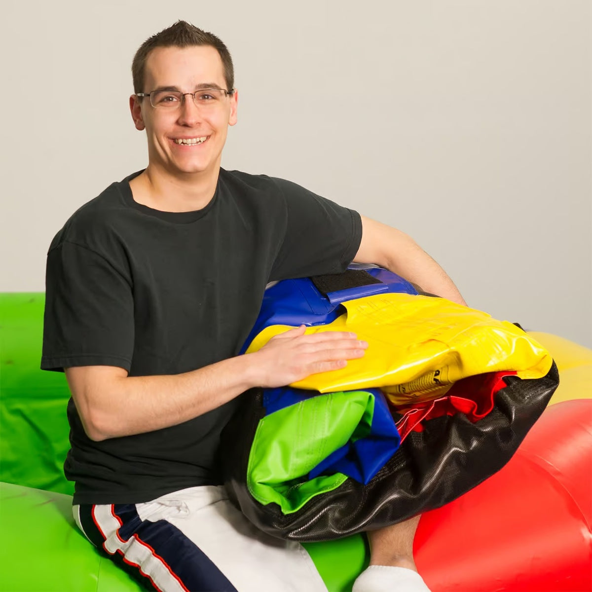 Guy holding deflated Fitness Wheel