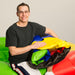 Guy holding deflated Fitness Wheel