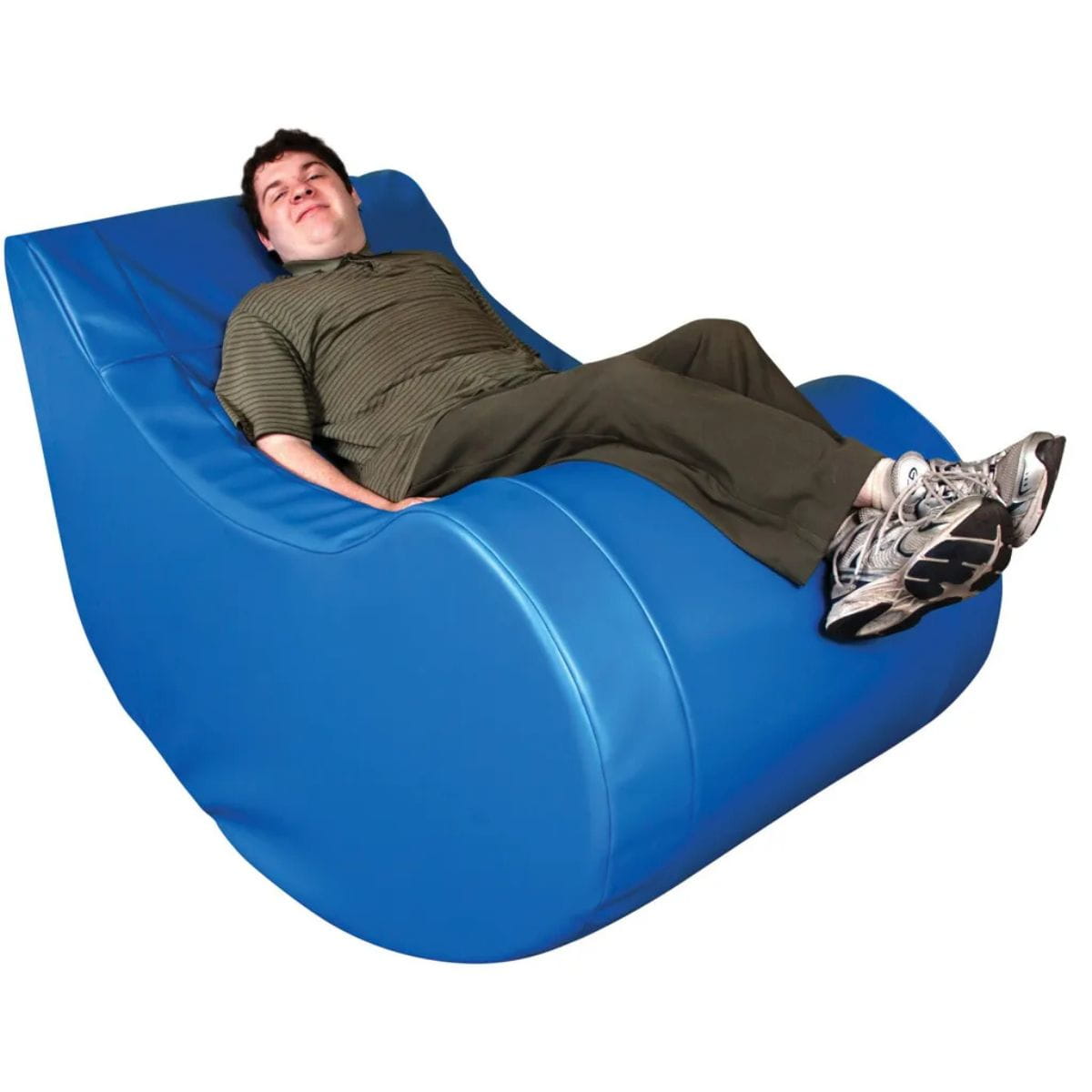 Guy sitting in the Vibroacoustic Therapy Chair with a happy face