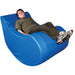 Guy sitting in the Vibroacoustic Therapy Chair with a happy face
