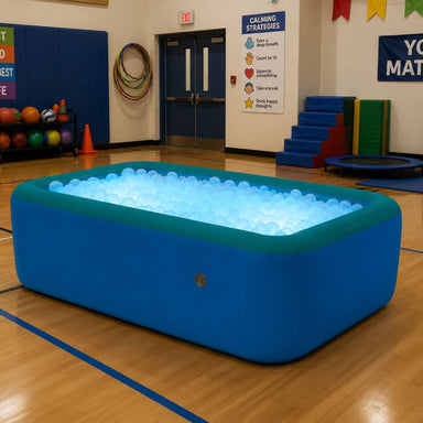 Illuminated Inflatable Ball Pit in school gym ready for kids to play in it