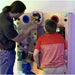 Kid and Adult playing with the Gravity Wonder Sensory Wall