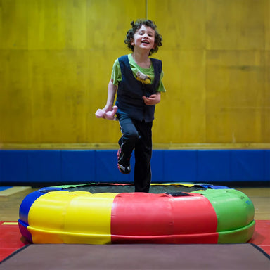 Kid bouncing on Sensory Fitness Wheel