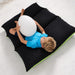 Kid laying down with the LED Mood Egg