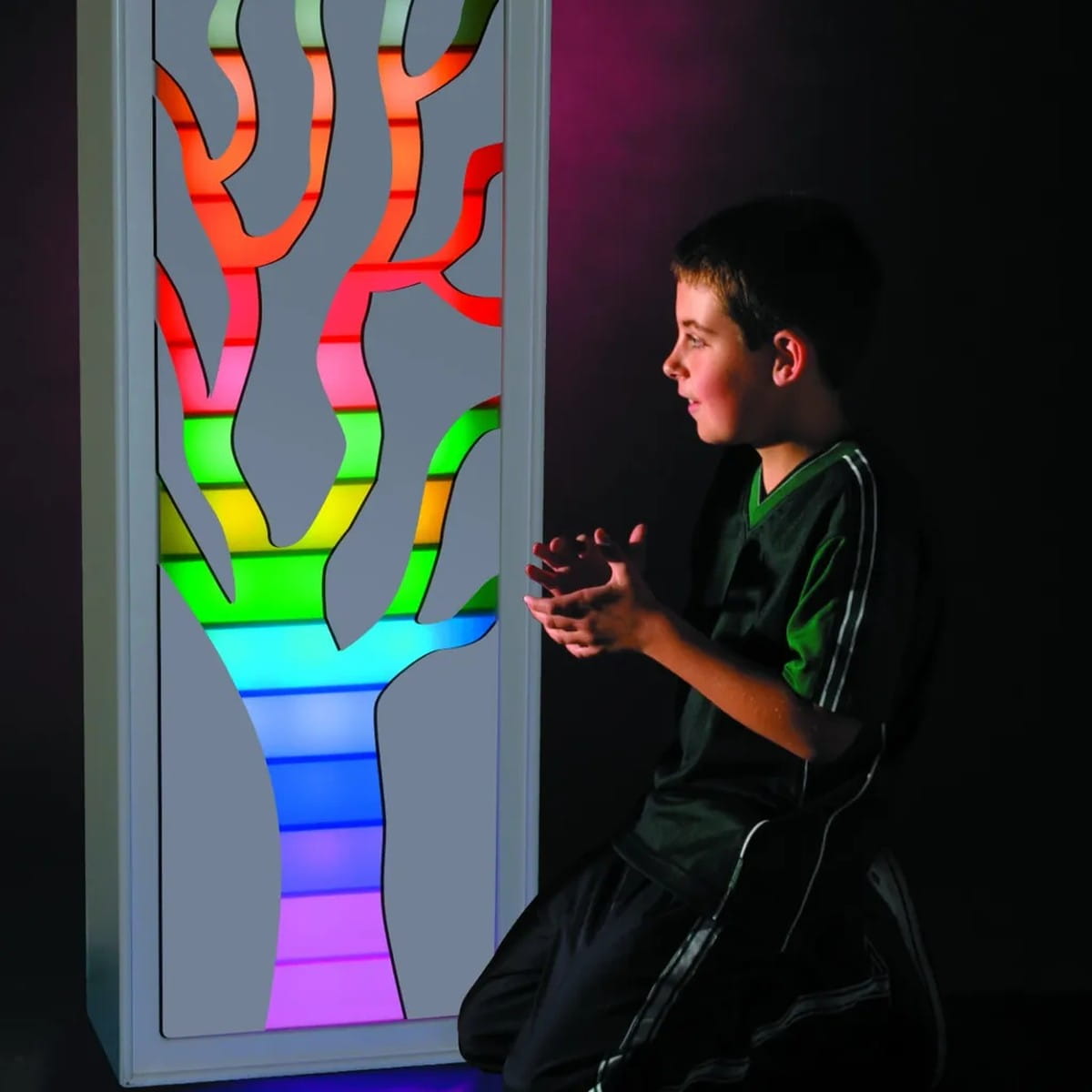 Kid looking at the Tree Pattern on the TFH Sensory Ladder Lights