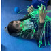 Kid on floor playing with Interactive Fiber Optic Spray in his hands