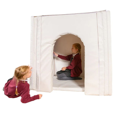 Kid playing inside the Portable Sensory Den while another is outside it looking in