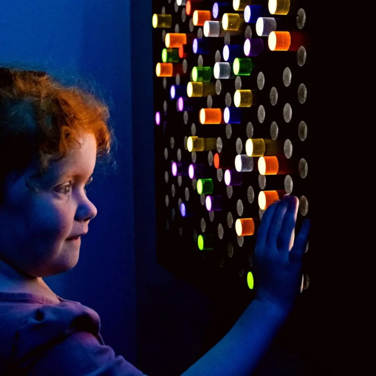 Kid palying with TFH Light Bright Wall Panel 