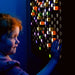 Kid palying with TFH Light Bright Wall Panel 