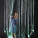 Kid playing with the Fiber Optic Curtain Lights mounted from the ceiling