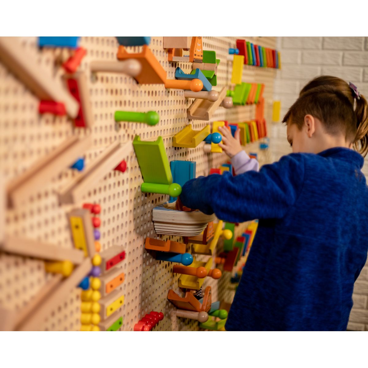 Kids playing multiple games on the LiteZilla Kidworx Interactive Game Board
