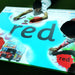 Kids laying out on image from Budii Interactive Projector