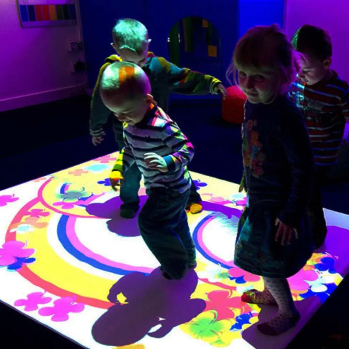 Kids playing on image from omiVista Ceiling Mounted Interactive Projector