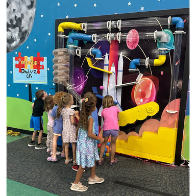 Kids playing with the Ultimate Ball Launcher with excitement