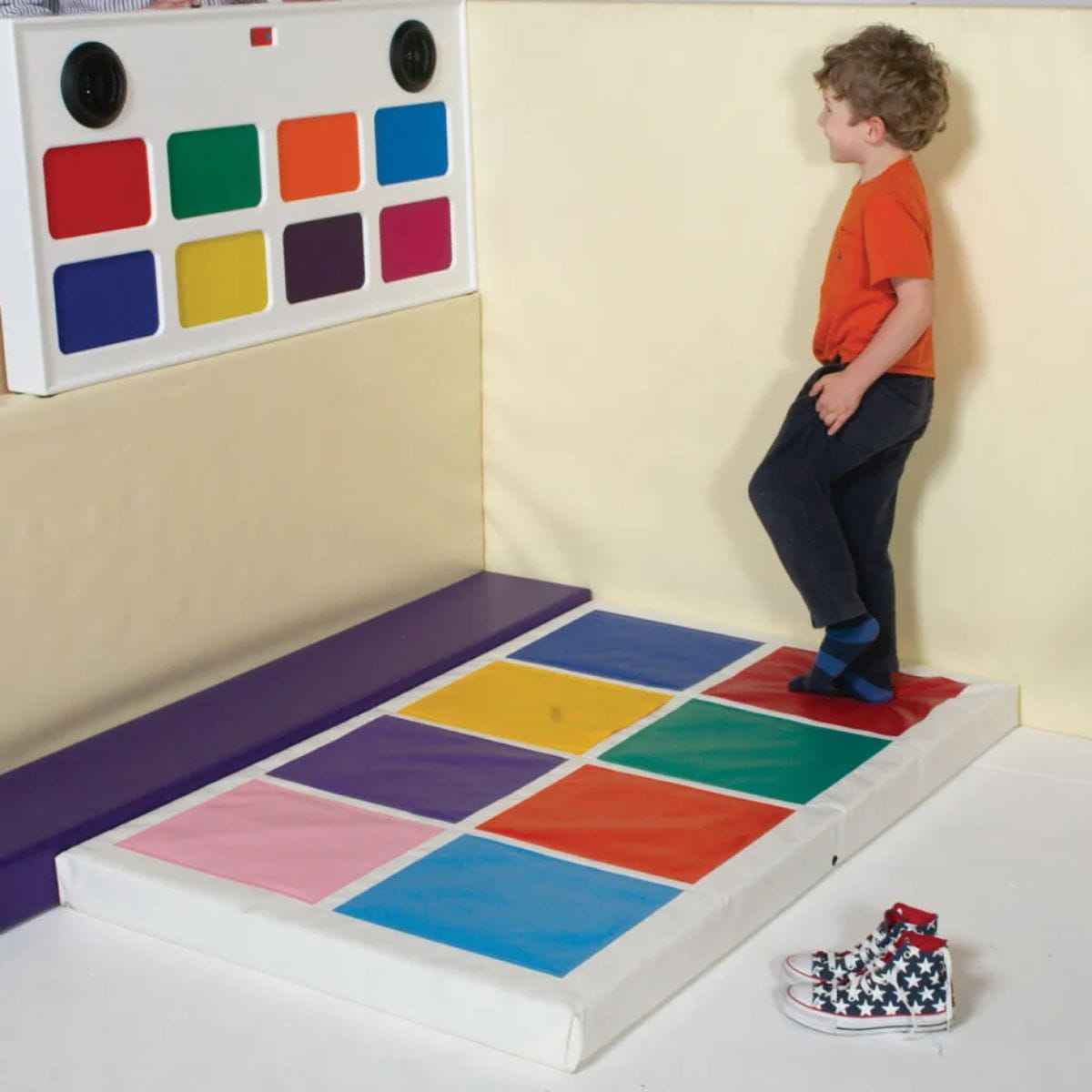 Kid standing on the TFH Musical Squares Sensory Game ready to play