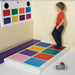 Kid standing on the TFH Musical Squares Sensory Game ready to play