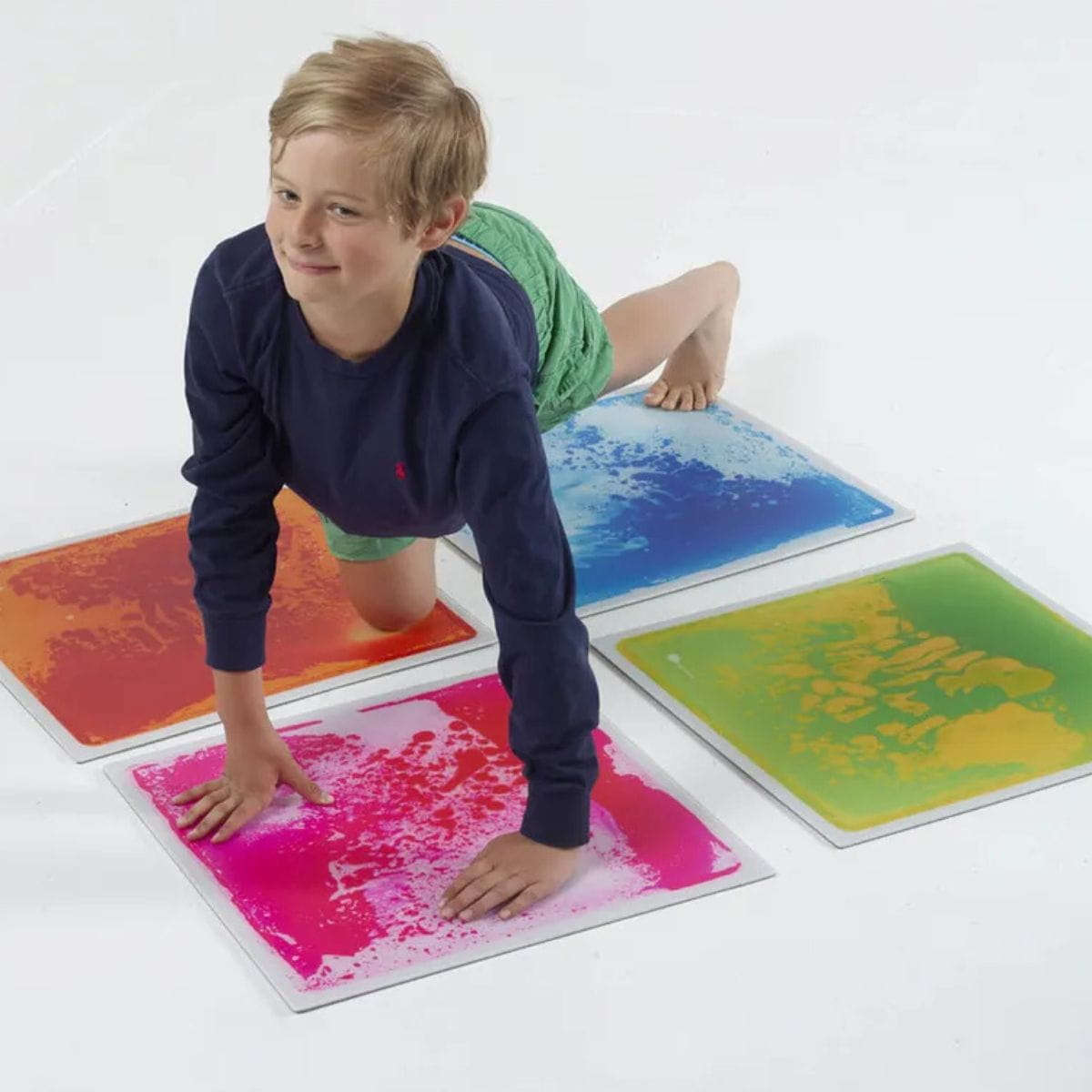 Kid with hands and feet on Large Square Liquid Sensory Floor Tiles