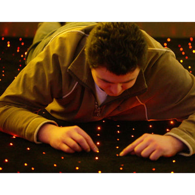Laying on the floor and playing with the LED Fiber Optic carpet lights