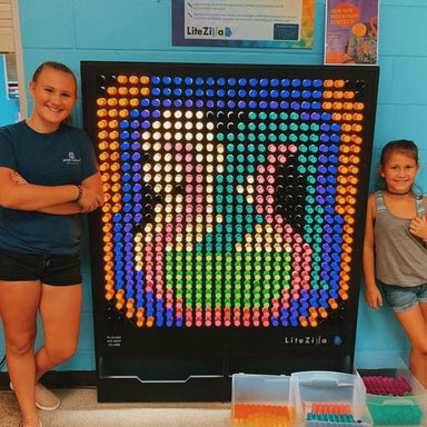 LiteZilla Light Wall 4x5 in Black with two females standing next to their design