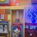 LiteZilla PomPom Cyclone Interactive Tube Setup next to other exhibits