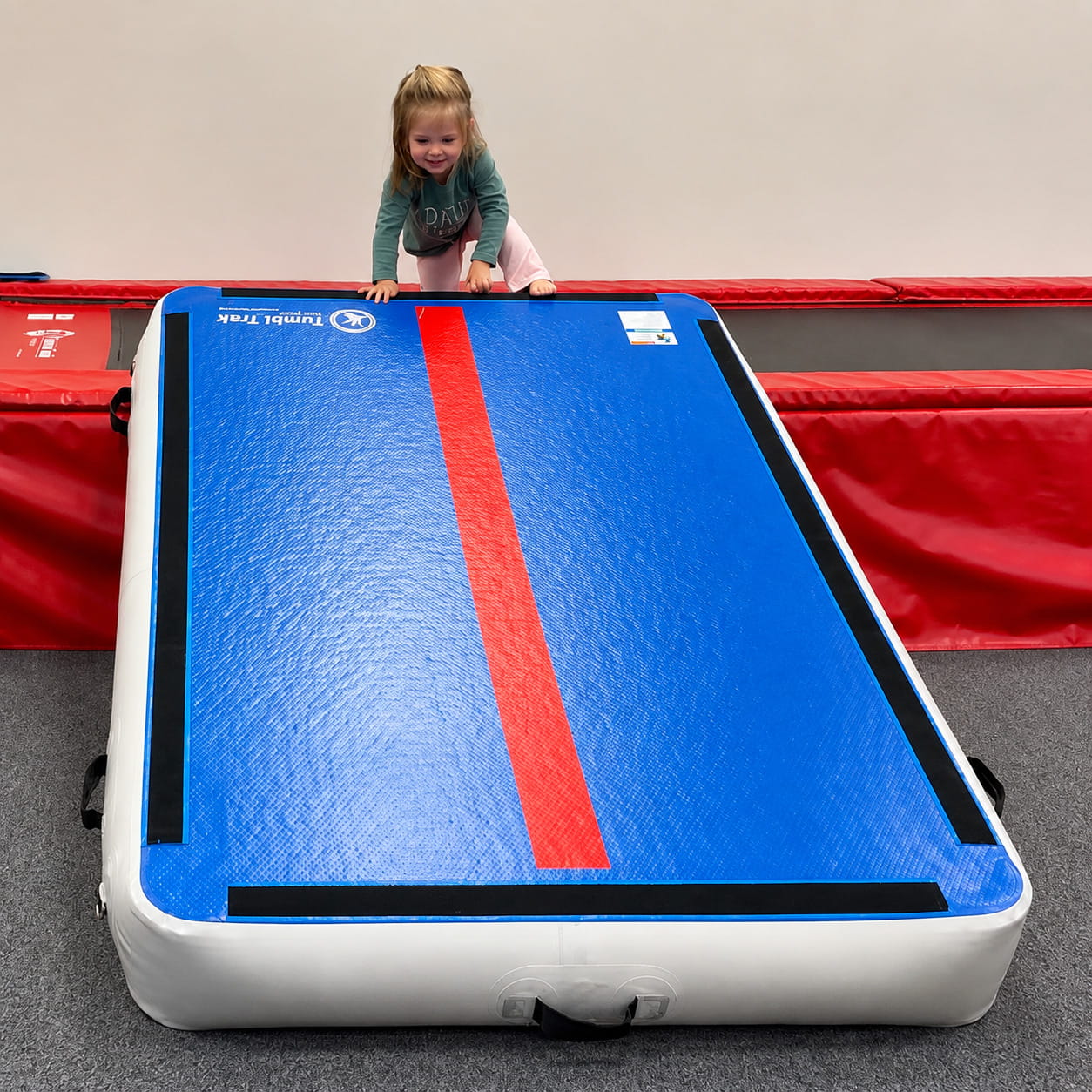Little kid ready to go down the tilted Tumbl Trak Power Launch