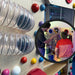 Mirrored image of kid and adult on the Gravity Wonder Sensory Wall