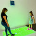 Mom and daughter playing soccer on image from Budii Interactive Projector