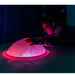 Person with hands on the TFH Sound Light Dome looking in amazement at the pink colors