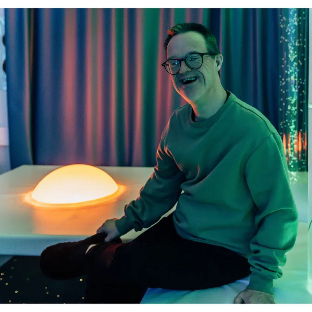 Platform Sound Light Dome with person next to it smiling