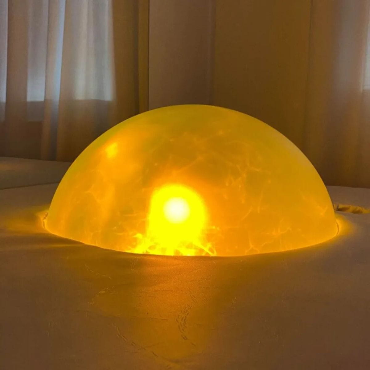 Podium Sound Light Dome with yellow radiating from it