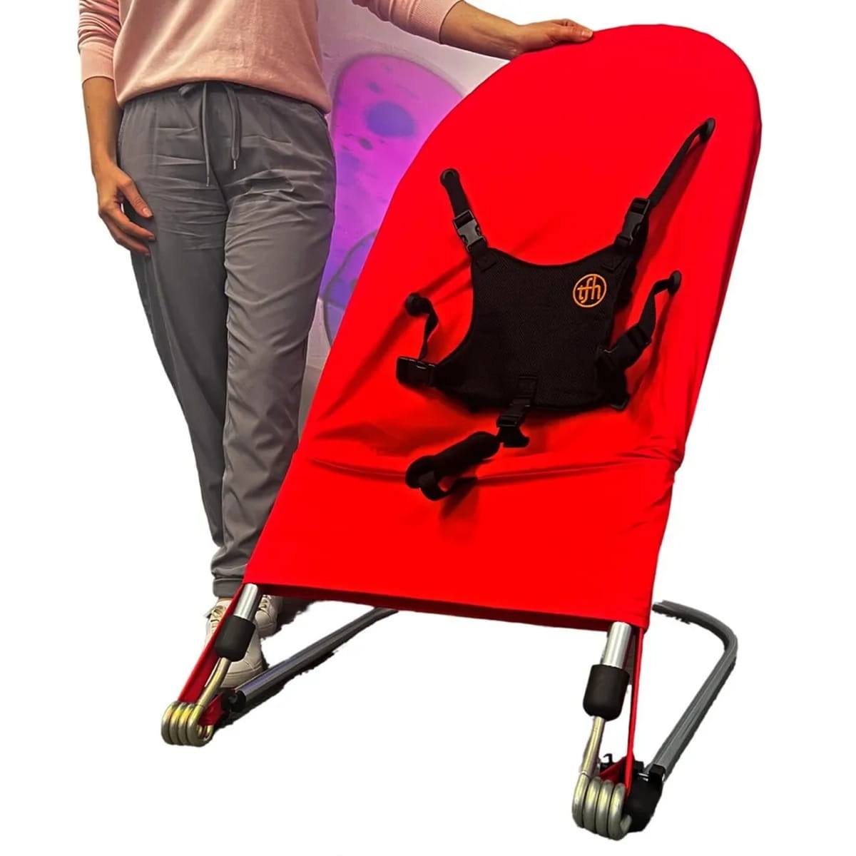 Sensory Bouncy Chair in Red with next to a person standing