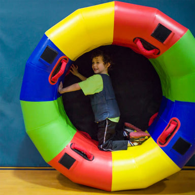 Sensory Fitness Wheel on edge with kid rolling in it