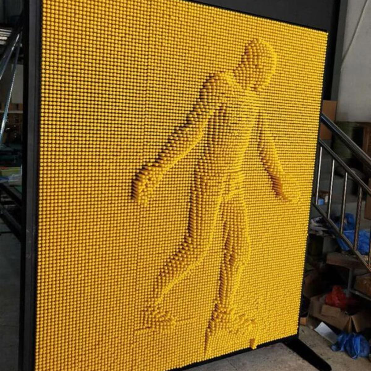 Silhouette of person on the LiteZilla Giant Pin Wall 