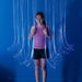 Smiling kid hanging on to the blue Fiber Optic Curtain Lights