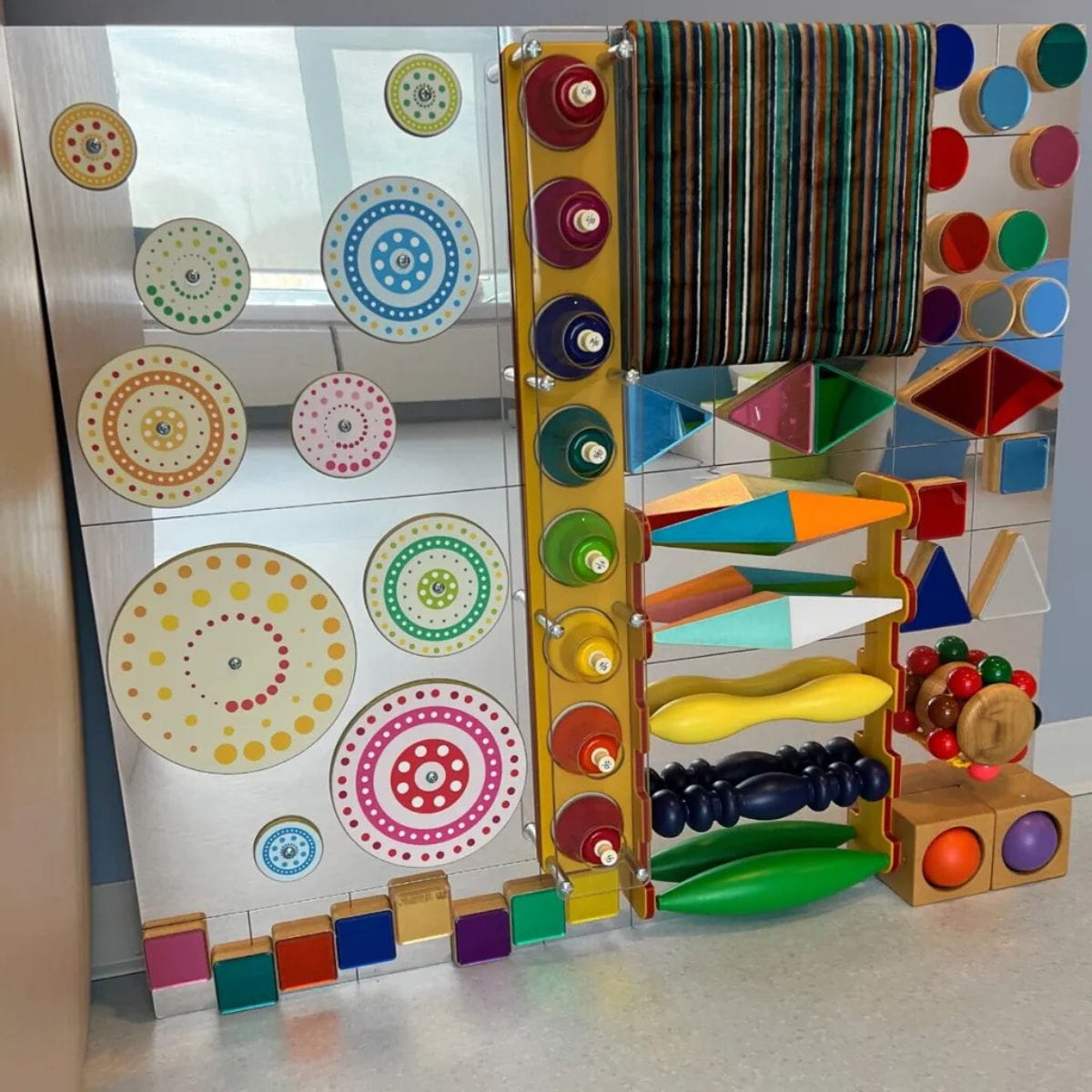 TFH Kinetic Wonder Wall set up against a wall with reflections in it