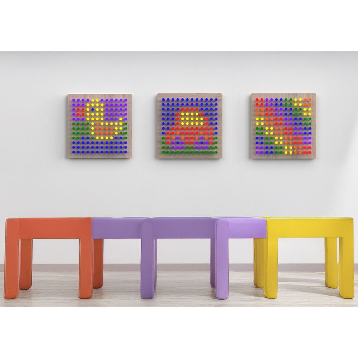 Three LiteZilla Mini Light Brights hung on wall with designs on each